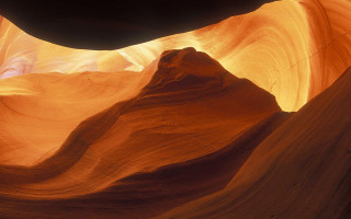 Large rock formation central cave - naturalism free wallpaper