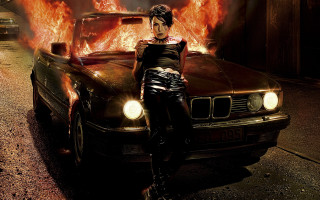 Woman car fire embers sunset - a car free wallpaper