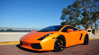 Bright orange sports car bridge 2 - vibrant color free wallpaper