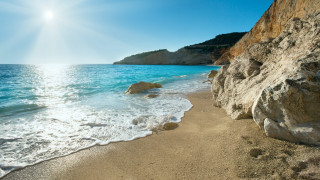 Sandy beach rock cliff blue - a sandy beach free wallpaper