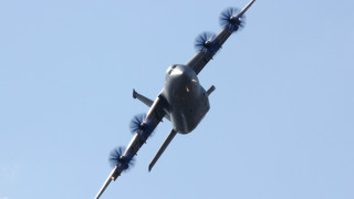 Large airplane blue sky smoke - wing and a propeller free wallpaper