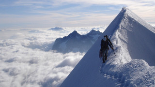Mountain climber snowy sky beach - hard edge free wallpaper