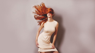 Red haired woman wind blown - flowing hair free wallpaper