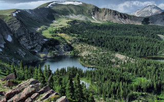 Mountain lake forest rocks sky 9 - a cloudy sky above free wallpaper