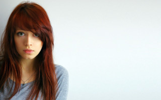 Red haired woman blue eyes 22 - a white wall free wallpaper