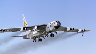 Large jetliner blue sky smoke - gear free wallpaper