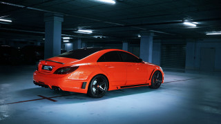 Bright orange car parking garage - a parking garage free wallpaper