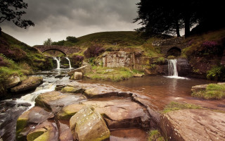 Small waterfall rocky stream bridge 2 - a bridge in the background free wallpaper