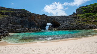 Beach rock arch lake ocean - the middle of it free wallpaper