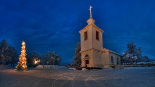 Church lit christmas snowy night - a church free wallpaper