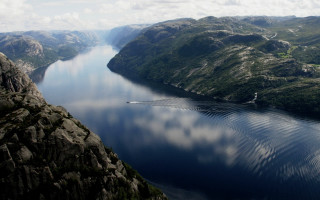Mountain lake boat landscape sky - a large body of water free wallpaper