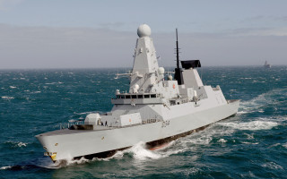 Large gray ship ocean military - a smaller boat in the background free wallpaper
