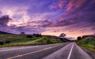 Cloudy sky hill road cityscape - tree and grass free wallpaper