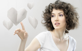 Woman pointing heart mobile curly - suspended free wallpaper