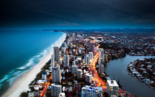 City beach ocean night cityscape - a dark sky free wallpaper