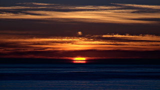 Sunset clouds boat water mountain - sunset free wallpaper
