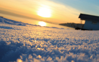 Snowy field distant house orange - the sun in the distance free wallpaper