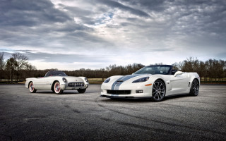 White sports cars cloudy horizon - a parking lot under a cloudy sky free wallpaper