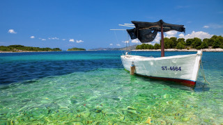 Beach island boat water sky - impressionist free wallpaper
