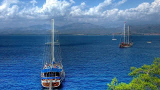 Boat water hillside cloudy sky - panoramic view free wallpaper