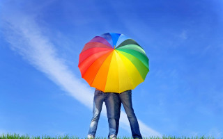 Rainbow umbrella grass blue sky - a person holding free wallpaper