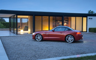 Red sports car night house - constant permeke free wallpaper