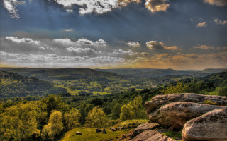 Scenic valley mountains clouds rocks - a scenic view of a valley free wallpaper