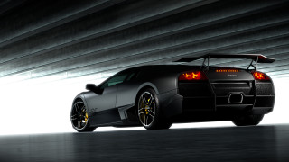 Black sports car yellow wheels 4 - a tunnel free wallpaper