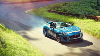 Blue sports car driving green - excessivism free wallpaper