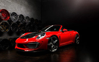Red sports car garage tires - a black background behind free wallpaper