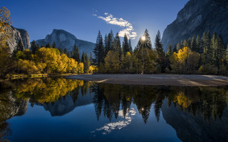Lake mountains trees sun clouds 6 - a bright sun in the background free wallpaper