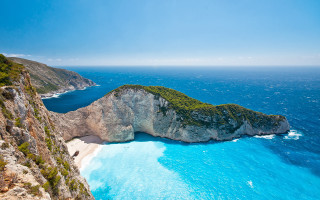 Large rock formation water beach 2 - a beach below free wallpaper