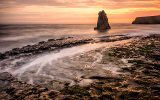 Ocean rock formation sunset beach - adobe lightroom free wallpaper
