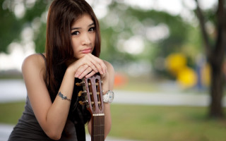 Woman tattoo guitar serious portrait - a guitar free wallpaper