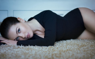 Woman laying black dress heels 2 - a black dress and heels free wallpaper