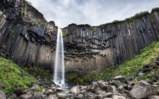 Waterfall rocks grass cloudy sky - rock and grass free wallpaper