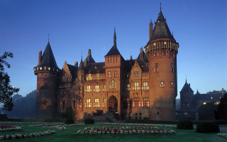 Castle clocktower flowerbed night architecture - the front of it free wallpaper