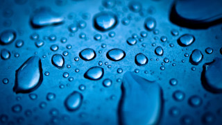 Water droplets blue surface macro 6 - a white border free wallpaper
