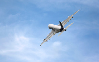 Large jetliner blue sky clouds 3 - free airplane wallpaper