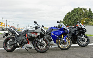 Motorcycles street fence trees building 2 - a building free wallpaper