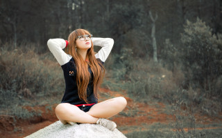 Woman sitting rock anime outdoors - her hand behind her head free wallpaper