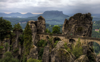 Stone bridge valley mountains cloudy 2 - florence engelbach free wallpaper