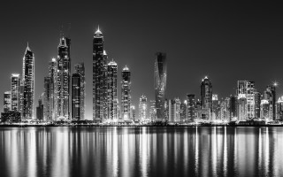 City skyline night reflections boat 3 - the water and a boat free wallpaper