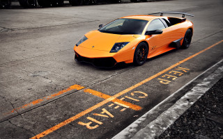 Orange sports car parked yellow - nice free wallpaper