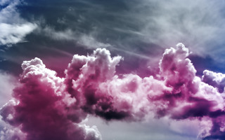 Large colorful clouds mountain ocean - a blue sky background free wallpaper