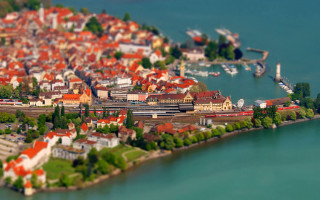 Small town river bridge bicycles - tilt shift free wallpaper