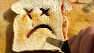 Person cutting bread face knife - a face free wallpaper