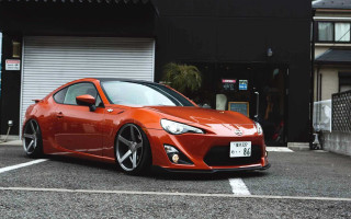 Red sports car garage japanese - a parking lot next free wallpaper