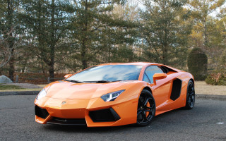 Bright orange sports car parking 6 - orange sports car free wallpaper