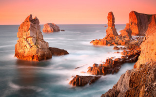 Rocky coast sunset pink sky - a pink sky free wallpaper